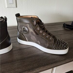 Christian Louboutin high tops with spike toes and green camo